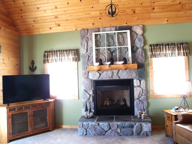 carpeted living room with lofted ceiling, wooden ceiling, a fireplace, and baseboards