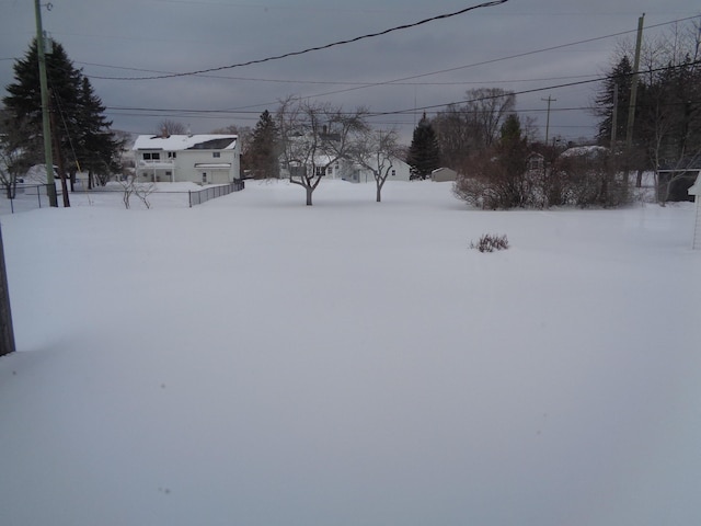 view of yard covered in snow