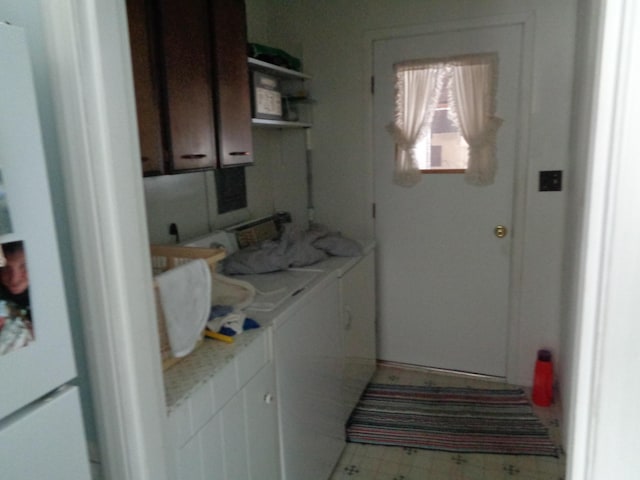 laundry room with tile patterned floors