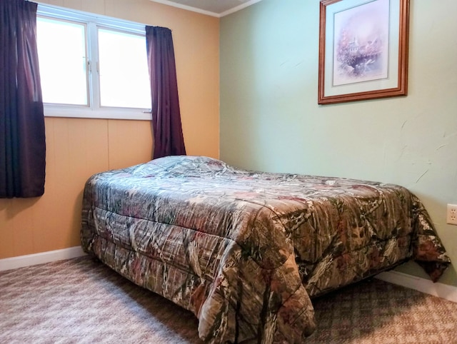 bedroom featuring ornamental molding, carpet flooring, and baseboards