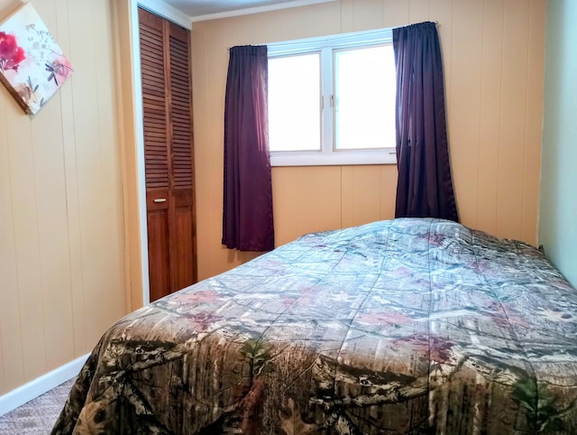 bedroom featuring a closet and baseboards