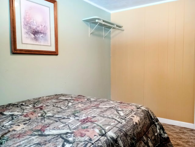 bedroom with carpet floors and ornamental molding