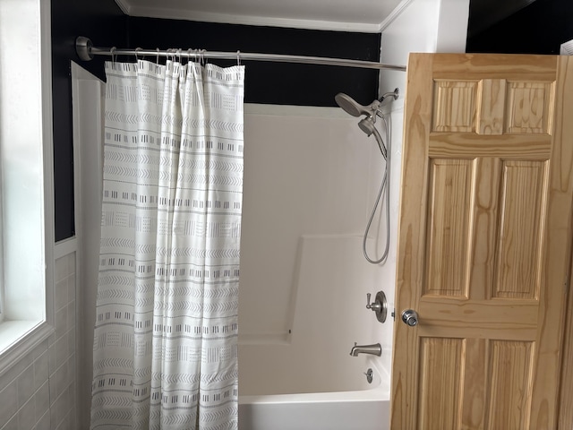 bathroom with shower / tub combo with curtain