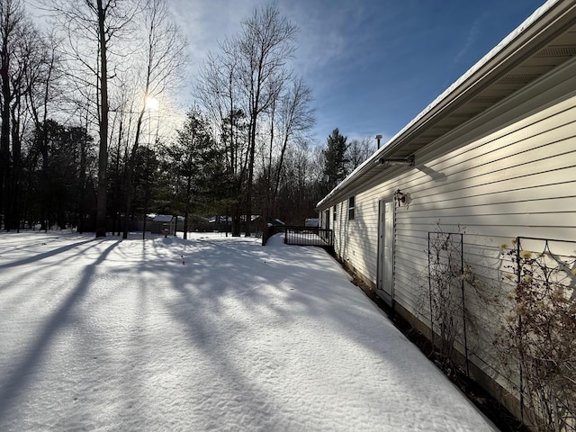 view of yard covered in snow