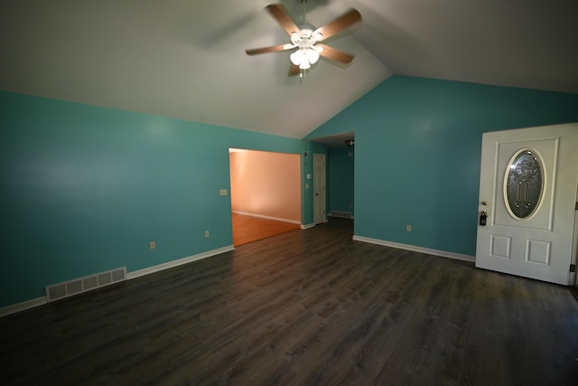 interior space featuring lofted ceiling, baseboards, visible vents, and dark wood-style flooring