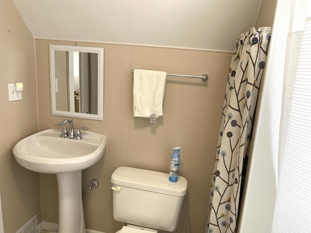 bathroom with visible vents and toilet