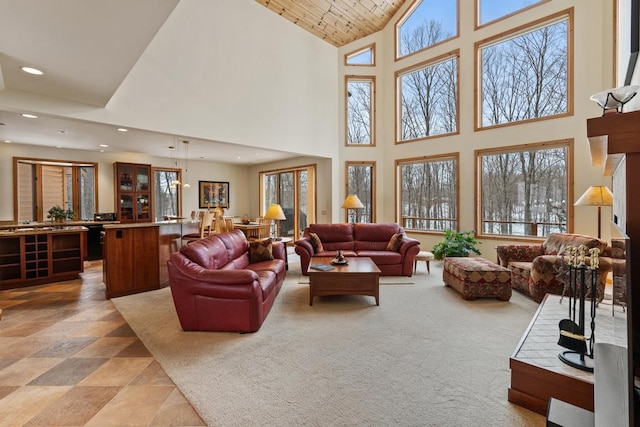 living room with recessed lighting, wood ceiling, light colored carpet, and vaulted ceiling