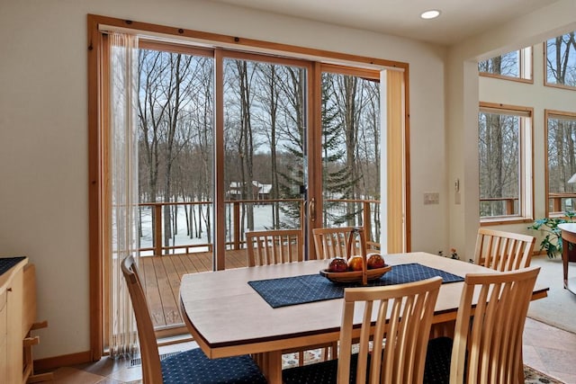 dining space featuring baseboards and recessed lighting