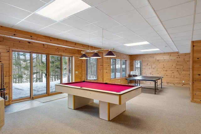 rec room with pool table, wood walls, a drop ceiling, and carpet flooring