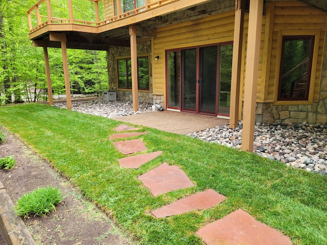 view of yard with a patio and a wooden deck