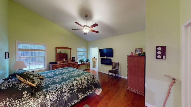 bedroom with multiple windows, vaulted ceiling, baseboards, and wood finished floors