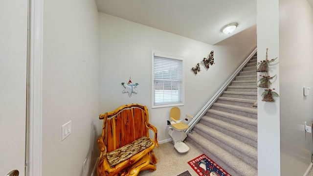 interior space with carpet flooring and baseboards