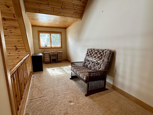 sitting room with wooden ceiling, carpet flooring, and baseboards