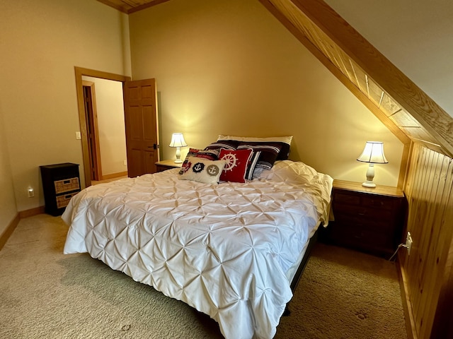 bedroom featuring carpet floors, high vaulted ceiling, and baseboards