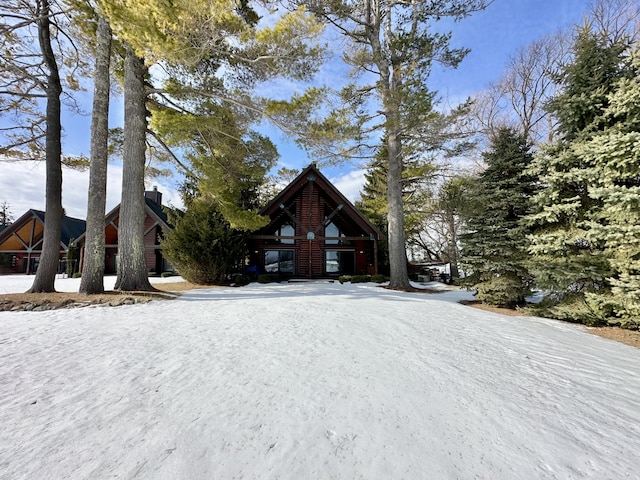 view of front of house featuring a chimney