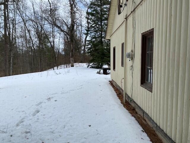 view of yard layered in snow