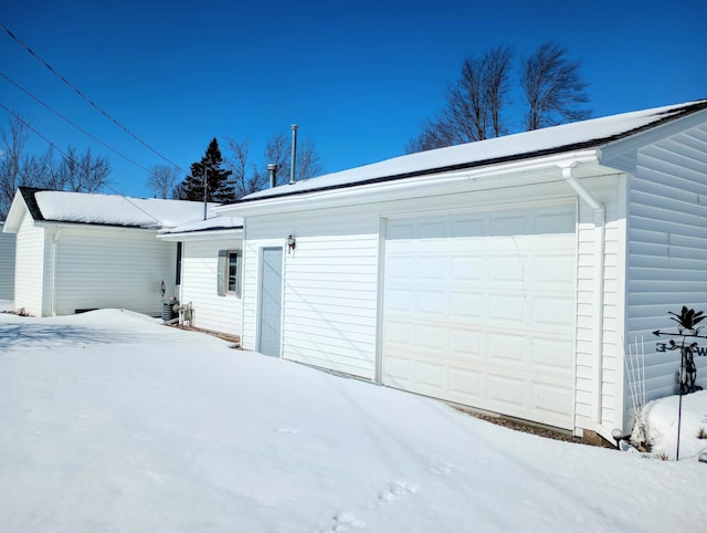 view of snow covered garage