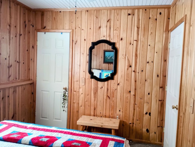 unfurnished bedroom with wood walls