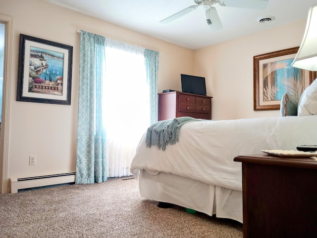 bedroom with carpet, visible vents, a baseboard heating unit, and ceiling fan