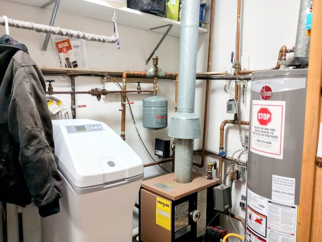 utility room featuring a heating unit and water heater