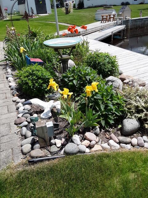 view of yard featuring a boat dock