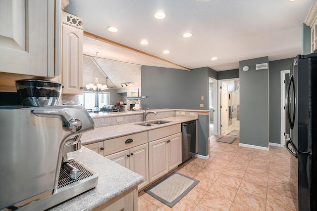 kitchen featuring light tile patterned floors, an inviting chandelier, freestanding refrigerator, a sink, and dishwasher