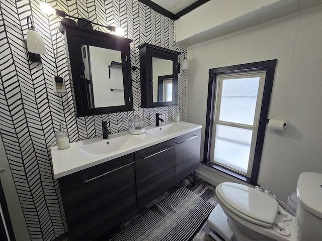 full bathroom with a sink, tasteful backsplash, toilet, and double vanity