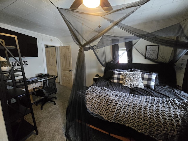 bedroom featuring ceiling fan and carpet