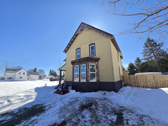 view of front of home featuring fence