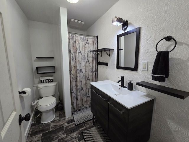 full bath featuring toilet and vanity