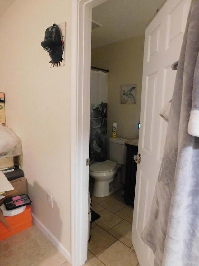 full bathroom featuring baseboards, vanity, toilet, and tile patterned floors