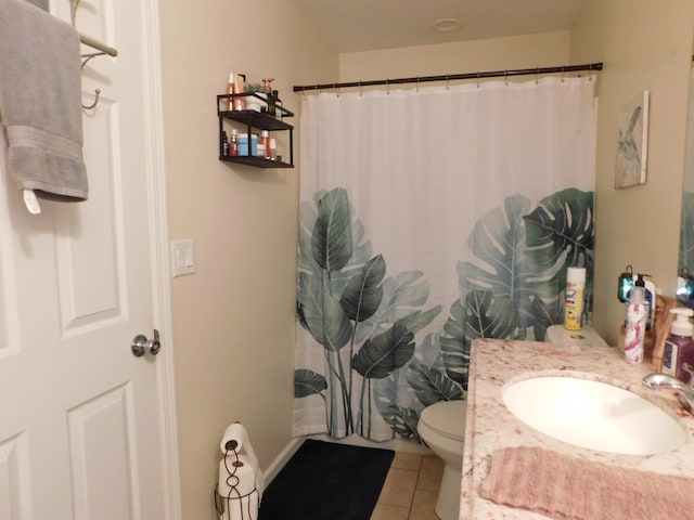 full bathroom with a shower with shower curtain, vanity, toilet, and tile patterned floors