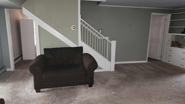 interior space featuring stairs, ornamental molding, baseboard heating, and carpet flooring