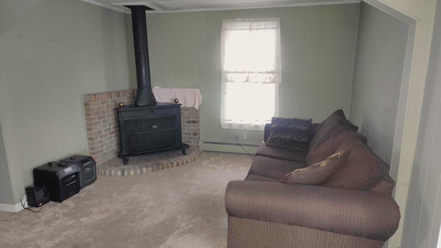 carpeted living room with a baseboard heating unit, ornamental molding, and a wood stove