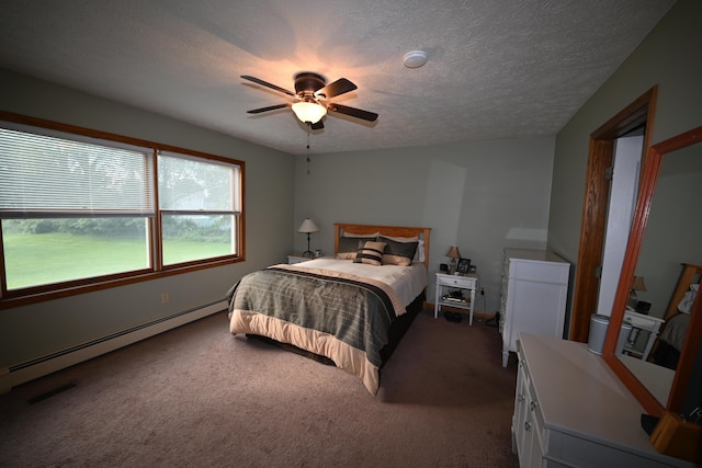 carpeted bedroom with ceiling fan, visible vents, baseboard heating, and a textured ceiling