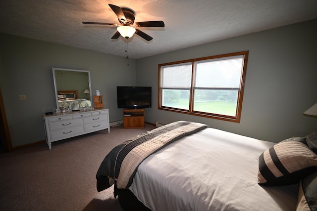 bedroom with a textured ceiling, carpet floors, a ceiling fan, baseboards, and baseboard heating