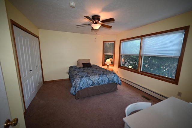 bedroom with baseboards, a ceiling fan, baseboard heating, carpet floors, and a closet