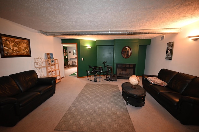 carpeted living room with visible vents, a fireplace, and a textured ceiling