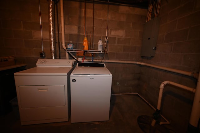 washroom featuring laundry area, electric panel, and separate washer and dryer