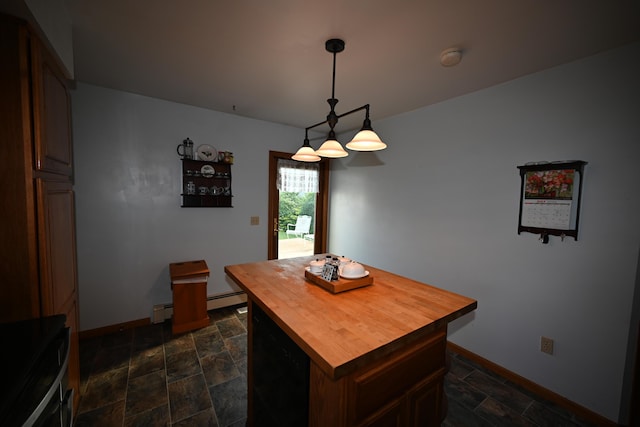 dining room with a baseboard radiator, stone finish flooring, and baseboards