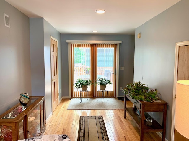 entryway featuring baseboards, recessed lighting, visible vents, and light wood-style floors