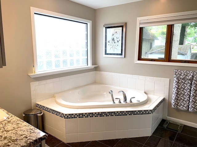 full bath with a bath and tile patterned floors