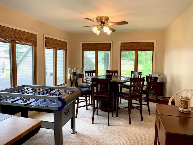 rec room featuring ceiling fan and light colored carpet