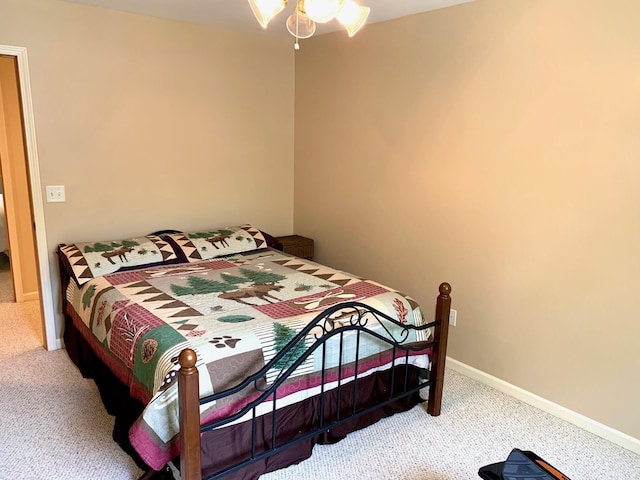 carpeted bedroom with baseboards