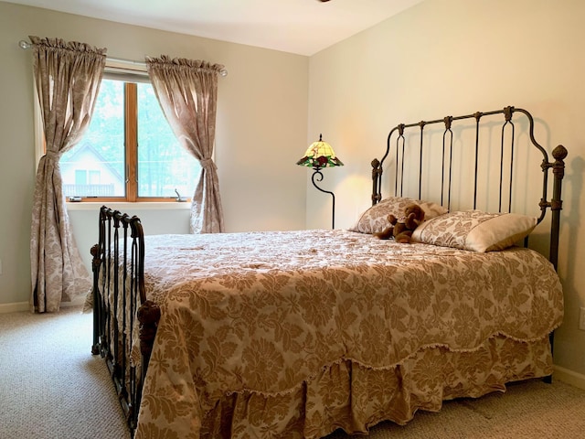 carpeted bedroom with baseboards