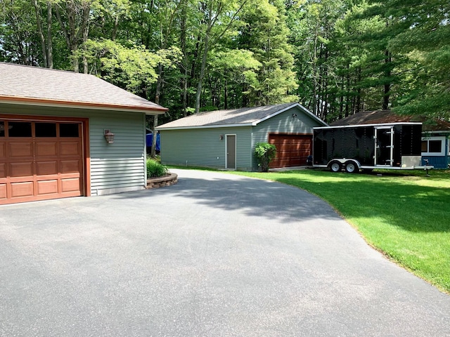 garage featuring driveway