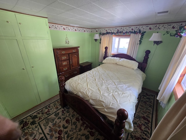 bedroom featuring visible vents