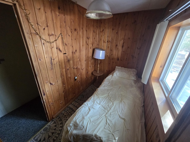 bedroom with wooden walls