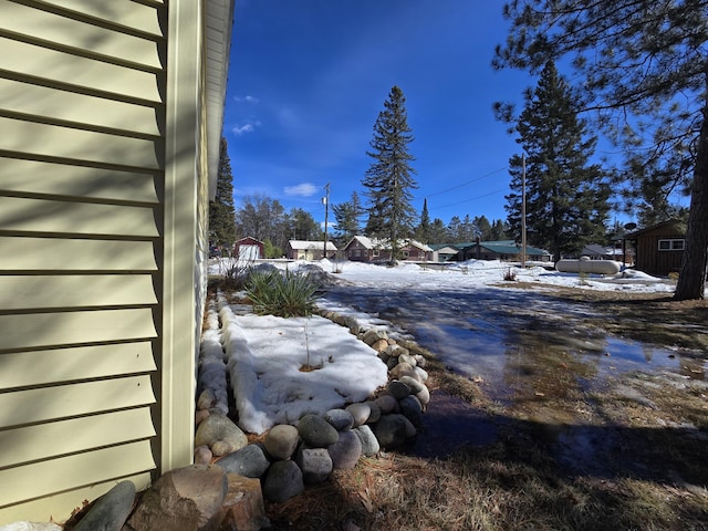 view of yard layered in snow