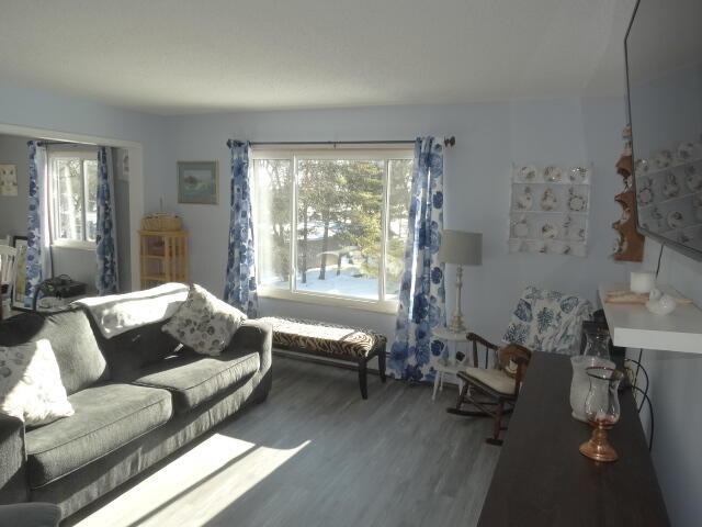 living area with wood finished floors